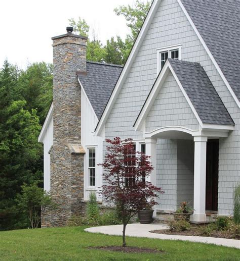 brick house with grey metal roof|brick and shingle combinations.